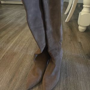 Knee high zip up heel boots